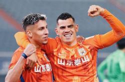 米兰体育新闻-上港客场胜鲁能，追赶领跑位置